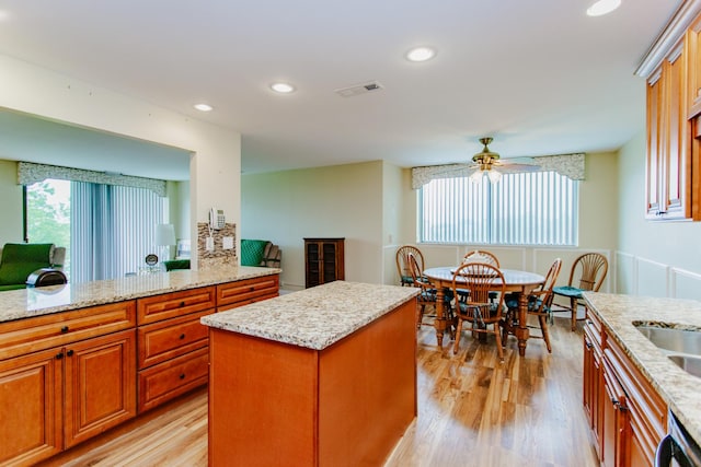 15 Bar Harbour Rd Unit 5A, Schaumburg, IL 60193 - kitchen featuring healthy amount of natural light, a ceiling fan, light stone countertops, light wood-style floors, and recessed lighting