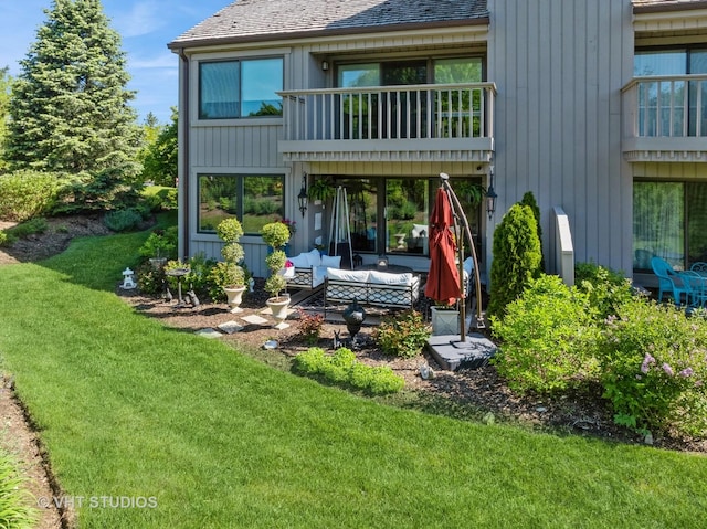 97 Thornhill Ln Unit D, Lake Barrington, IL 60010 - rear view of property featuring a yard, a balcony, a patio, and a shingled roof