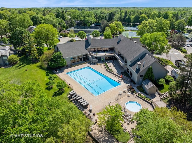 97 Thornhill Ln Unit D, Lake Barrington, IL 60010 - aerial view of property and surrounding area featuring a pool and a heavily wooded area