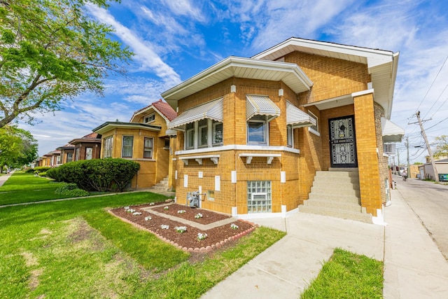 2535 Oak Park Ave, Berwyn, IL 60402 - view of front facade with a front lawn and brick siding