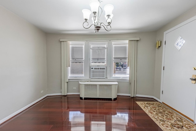 2535 Oak Park Ave, Berwyn, IL 60402 - entryway with a chandelier, baseboards, wood finished floors, radiator heating unit, and cooling unit