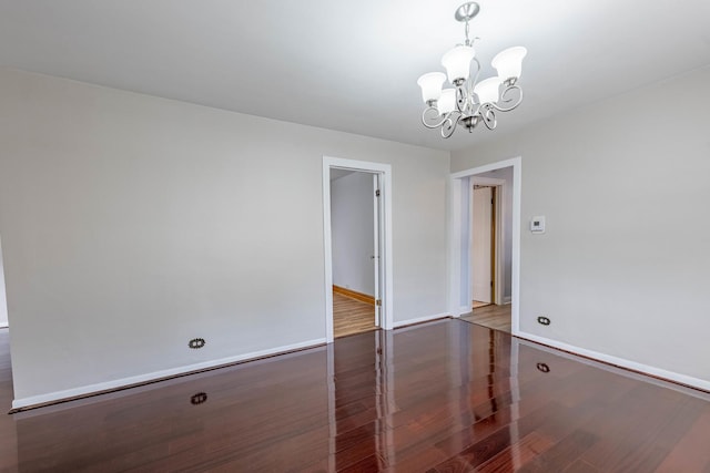 2535 Oak Park Ave, Berwyn, IL 60402 - unfurnished dining area featuring a chandelier, wood finished floors, and baseboards