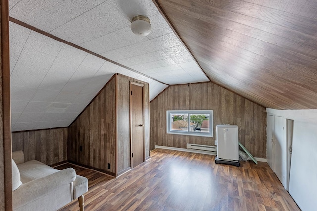 2535 Oak Park Ave, Berwyn, IL 60402 - bonus room with a baseboard radiator, wood finished floors, wood walls, and lofted ceiling