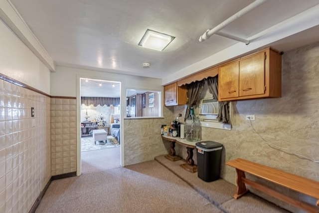 2535 Oak Park Ave, Berwyn, IL 60402 - kitchen with tile walls, brown cabinetry, and carpet