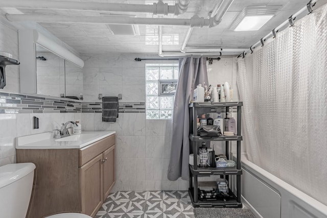 2535 Oak Park Ave, Berwyn, IL 60402 - full bath featuring toilet, vanity, shower / bath combo with shower curtain, tile patterned floors, and tile walls