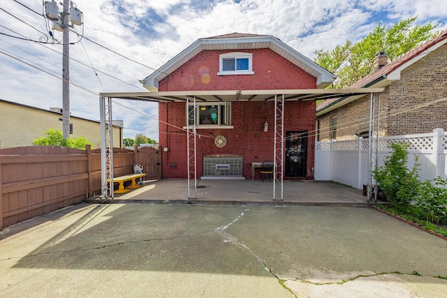 2535 Oak Park Ave, Berwyn, IL 60402 - rear view of property with brick siding and a gate