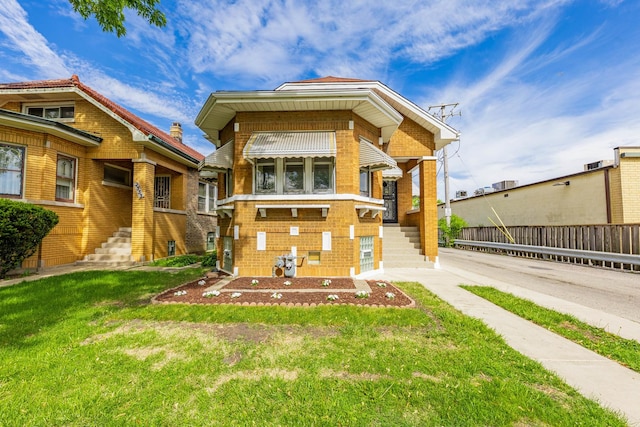 2535 Oak Park Ave, Berwyn, IL 60402 - view of front of house with a front yard and brick siding
