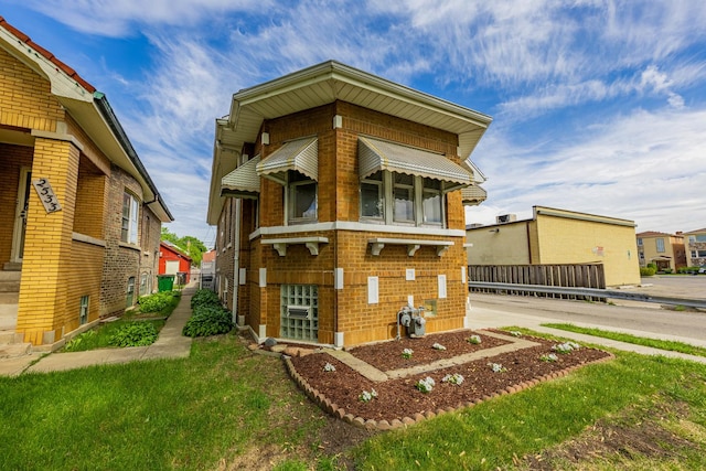 2535 Oak Park Ave, Berwyn, IL 60402 - view of front of home with brick siding and a front lawn