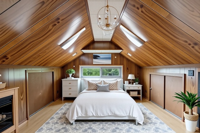2535 Oak Park Ave, Berwyn, IL 60402 - bedroom with lofted ceiling, light wood-style floors, wood walls, and wooden ceiling
