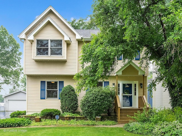 824 Dawes Ave, Wheaton, IL 60189 - view of front of home with an outdoor structure, a garage, entry steps, and a front lawn