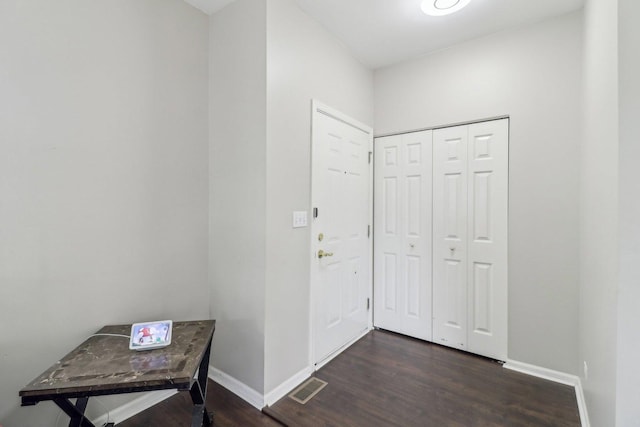 801 S Parkside Dr, Round Lake, IL 60073 - entryway with baseboards and dark wood-type flooring