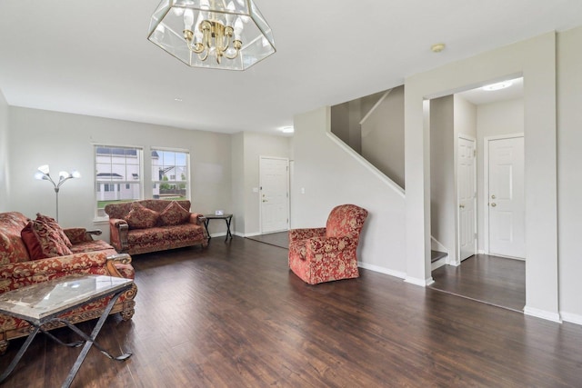 801 S Parkside Dr, Round Lake, IL 60073 - living area with stairway, wood finished floors, a chandelier, and baseboards