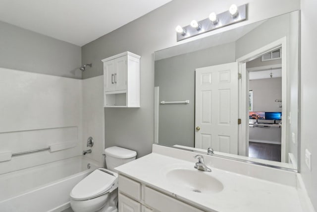 801 S Parkside Dr, Round Lake, IL 60073 - bathroom featuring vanity, washtub / shower combination, and toilet