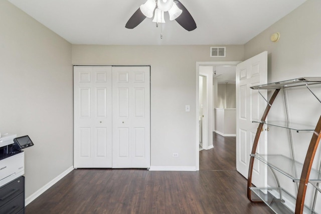 801 S Parkside Dr, Round Lake, IL 60073 - unfurnished bedroom with wood finished floors, baseboards, a closet, and a ceiling fan