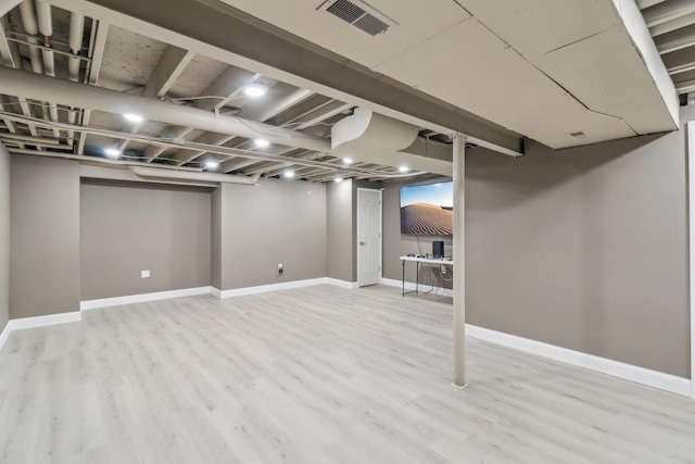 801 S Parkside Dr, Round Lake, IL 60073 - finished below grade area featuring light wood-type flooring and baseboards