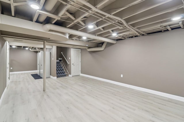 801 S Parkside Dr, Round Lake, IL 60073 - finished basement with stairway, wood finished floors, and baseboards