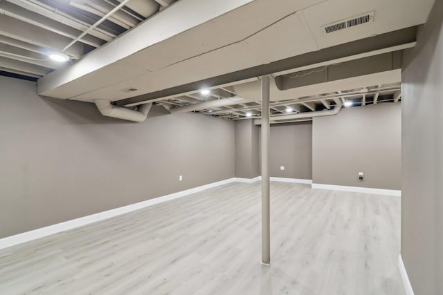 801 S Parkside Dr, Round Lake, IL 60073 - finished below grade area featuring wood finished floors and baseboards