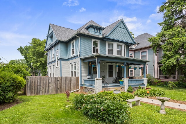 1104 W Church St, Champaign, IL 61821 - victorian house featuring covered porch and a shingled roof