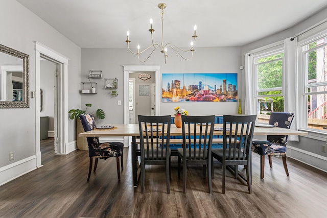 1104 W Church St, Champaign, IL 61821 - dining space featuring a chandelier, wood finished floors, and baseboards