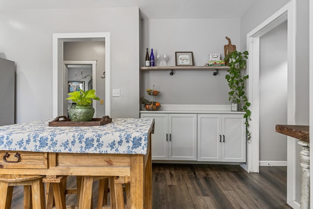1104 W Church St, Champaign, IL 61821 - dining room with dark wood-style flooring and baseboards