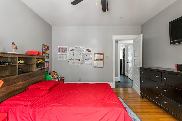 1104 W Church St, Champaign, IL 61821 - bedroom with wood finished floors, ceiling fan, and baseboards