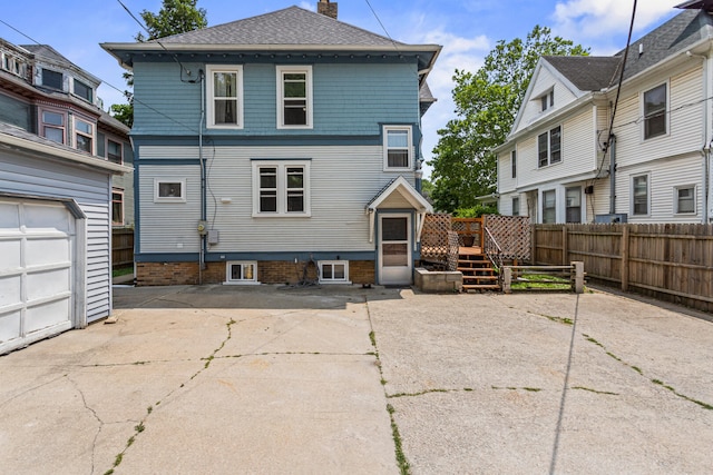 1104 W Church St, Champaign, IL 61821 - back of property with a chimney, a deck, and roof with shingles