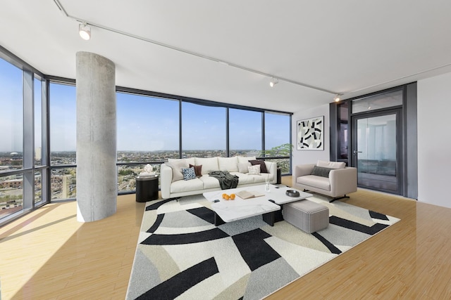 860 W Blackhawk St Unit 2102, Chicago, IL 60642 - living area featuring floor to ceiling windows, rail lighting, and wood finished floors