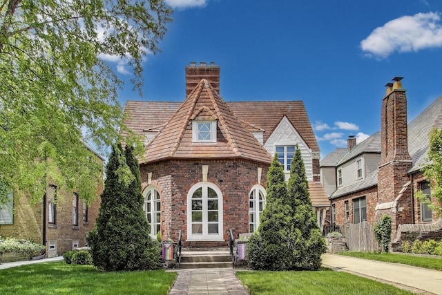 1213 Columbian Ave, Oak Park, IL 60302 - tudor home with a chimney and a front lawn