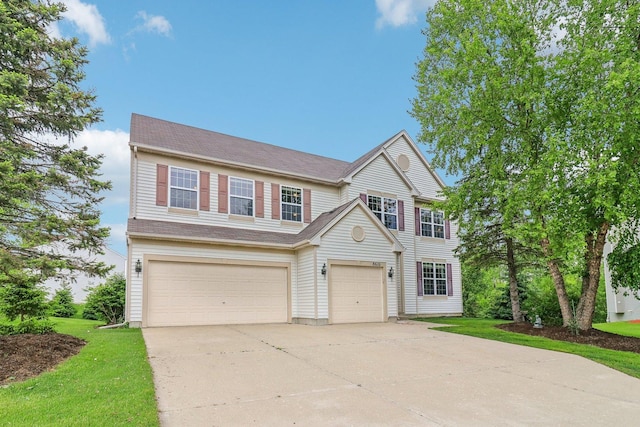 8610 Pebble Creek Ct, Wonder Lake, IL 60097 - view of front of house with driveway, an attached garage, and a front lawn