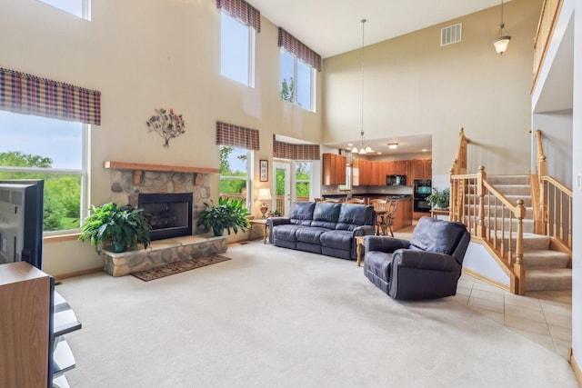 8610 Pebble Creek Ct, Wonder Lake, IL 60097 - living room featuring a towering ceiling, plenty of natural light, and light carpet