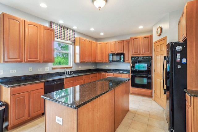 8610 Pebble Creek Ct, Wonder Lake, IL 60097 - kitchen featuring black appliances, a center island, a sink, dark stone countertops, and recessed lighting