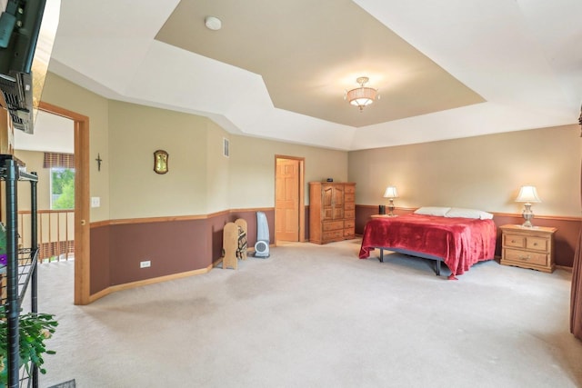 8610 Pebble Creek Ct, Wonder Lake, IL 60097 - carpeted bedroom featuring a raised ceiling and wainscoting
