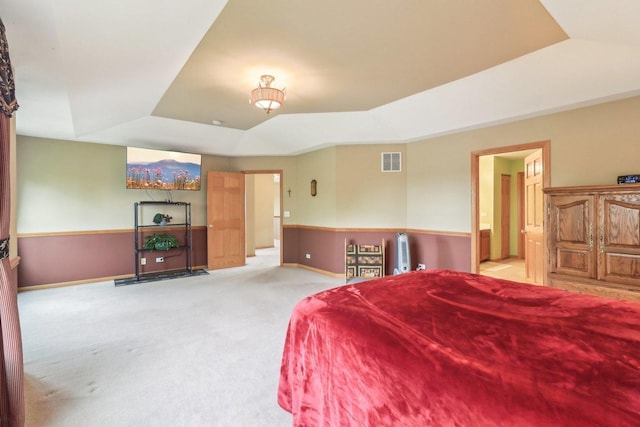 8610 Pebble Creek Ct, Wonder Lake, IL 60097 - bedroom with a tray ceiling, light carpet, baseboards, and ensuite bathroom