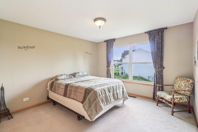 8610 Pebble Creek Ct, Wonder Lake, IL 60097 - bedroom with light carpet and baseboards