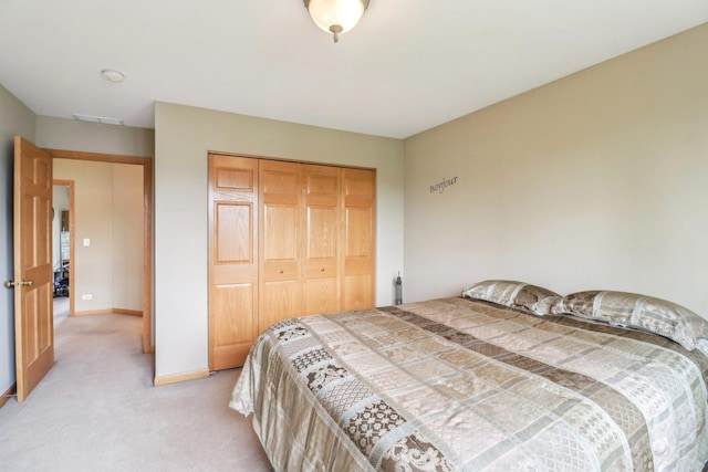 8610 Pebble Creek Ct, Wonder Lake, IL 60097 - bedroom featuring light carpet, a closet, and baseboards