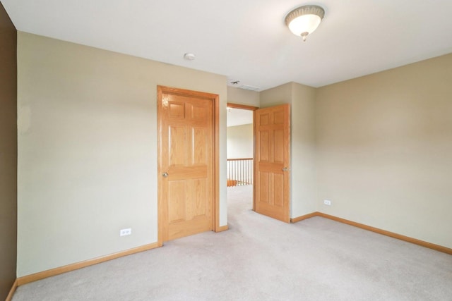 8610 Pebble Creek Ct, Wonder Lake, IL 60097 - unfurnished bedroom with baseboards and light carpet