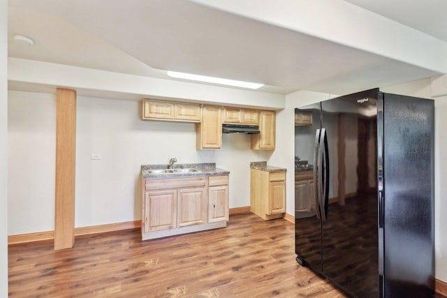 8610 Pebble Creek Ct, Wonder Lake, IL 60097 - kitchen featuring freestanding refrigerator, under cabinet range hood, a sink, light wood finished floors, and baseboards