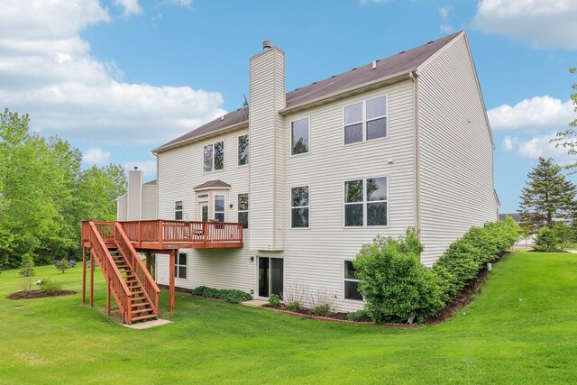 8610 Pebble Creek Ct, Wonder Lake, IL 60097 - rear view of house with a chimney, a deck, stairway, and a lawn