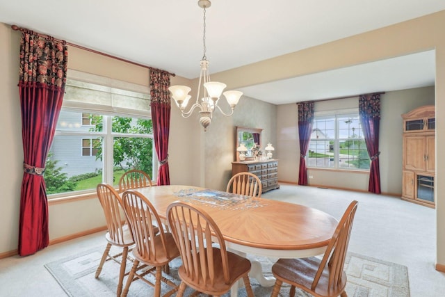 8610 Pebble Creek Ct, Wonder Lake, IL 60097 - dining room with a chandelier, light carpet, and baseboards