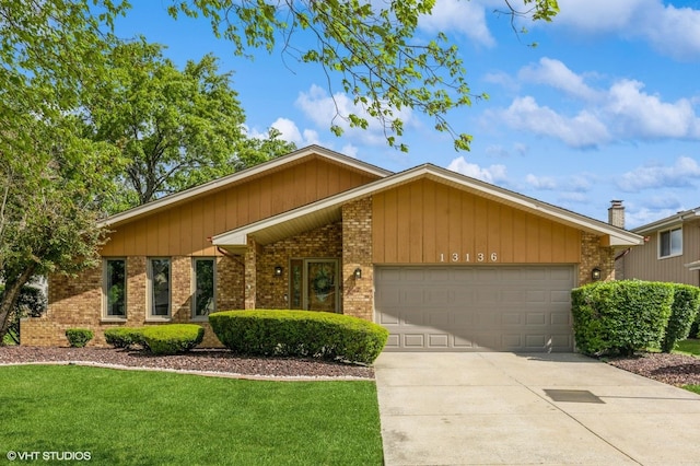 13136 Sage Ct, Homer Glen, IL 60491 - mid-century inspired home featuring brick siding, an attached garage, concrete driveway, and a front yard