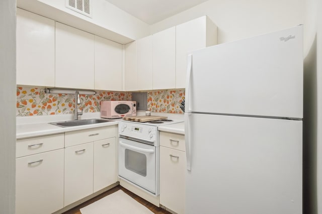 2400 N Lakeview Ave Unit 1108, Chicago, IL 60614 - kitchen with white appliances, a sink, light countertops, backsplash, and white cabinetry