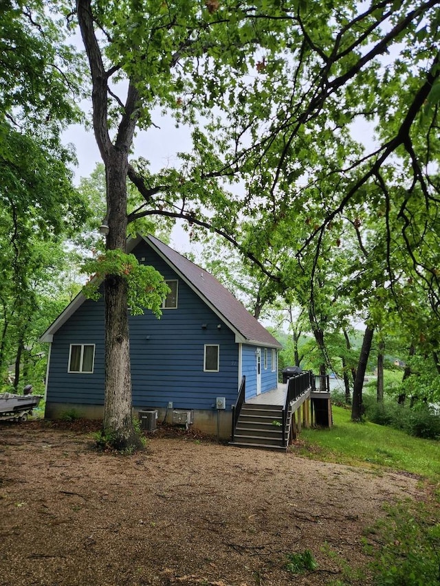 22 Cedar Ln, Putnam, IL 61560 - view of home's exterior with a wooden deck and cooling unit