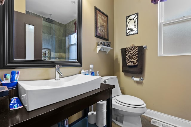 7424 S Euclid Ave, Chicago, IL 60649 - full bath with toilet, a tile shower, and vanity