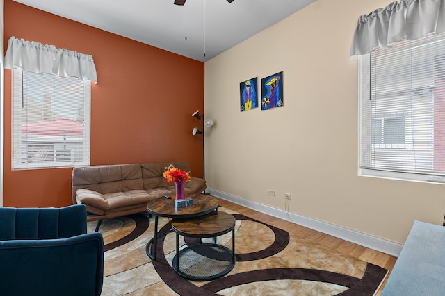 7424 S Euclid Ave, Chicago, IL 60649 - living room featuring light wood finished floors, a ceiling fan, and baseboards