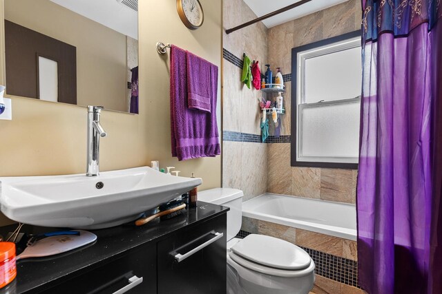 7424 S Euclid Ave, Chicago, IL 60649 - full bathroom featuring toilet, tiled shower / bath combo, and vanity