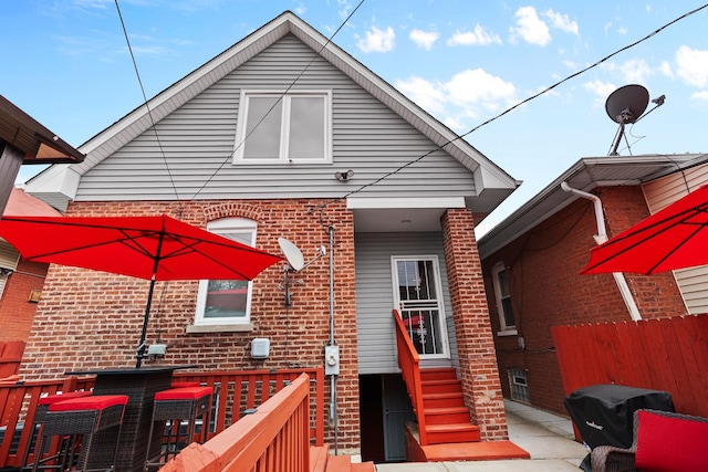 7424 S Euclid Ave, Chicago, IL 60649 - rear view of house featuring brick siding and entry steps