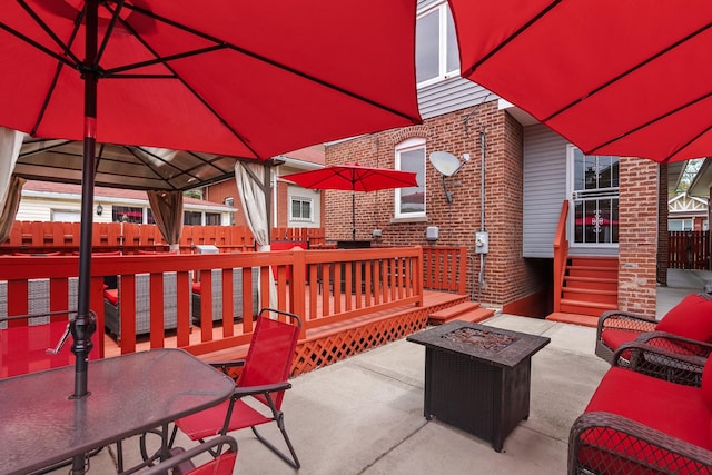 7424 S Euclid Ave, Chicago, IL 60649 - view of patio featuring a fire pit, a gazebo, and outdoor dining area