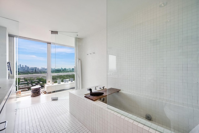 2400 N Lakeview Ave Unit 2803-04, Chicago, IL 60614 - bathroom featuring a view of skyline, tile patterned flooring, and tile walls