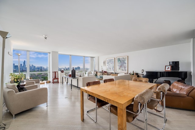 2400 N Lakeview Ave Unit 2803-04, Chicago, IL 60614 - dining room with floor to ceiling windows, a view of skyline, and light wood-type flooring