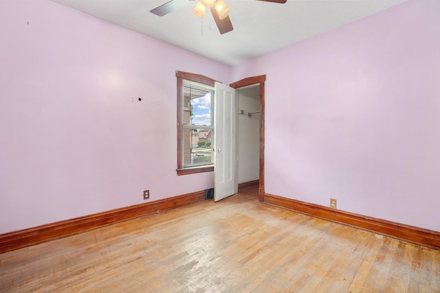 3229 N Oketo Ave, Chicago, IL 60634 - empty room with baseboards, light wood-style floors, and a ceiling fan